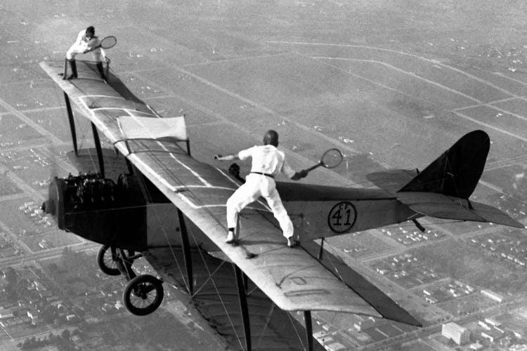 Playing Tennis on a Biplane in 1925