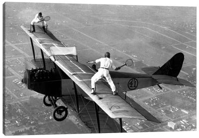 Playing Tennis on a Biplane in 1925 Canvas Art Print - Airplane Art