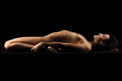Nude Woman Sensual Laying Down On Black Background by Alessandro Della Torre canvas print