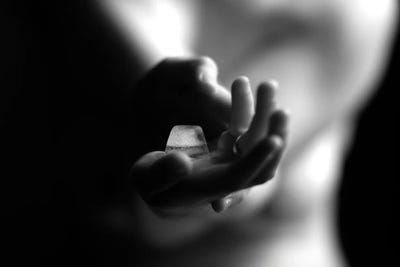 Nude Woman's Hands Holding Icecube by Alessandro Della Torre canvas print