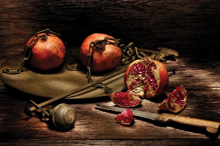 Pomegranates With Knife On A Wooden Table