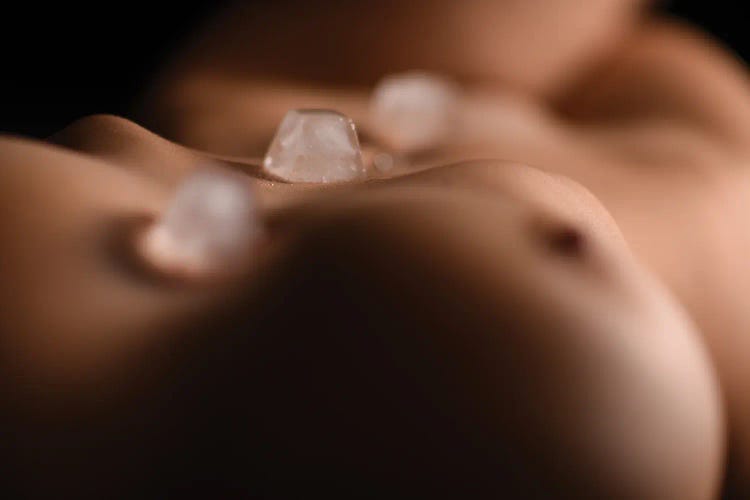 Ices Cubes On The Chest And Abdominal Of A Naked Body