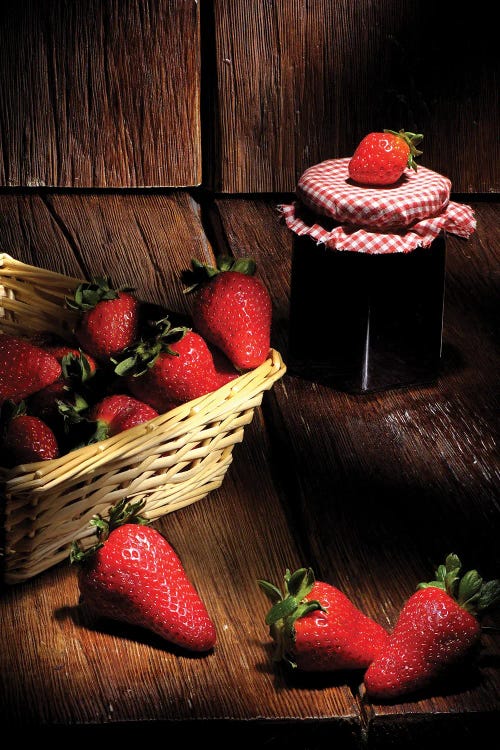 Red Strawberries And A Basket On A Wood Wooden Table