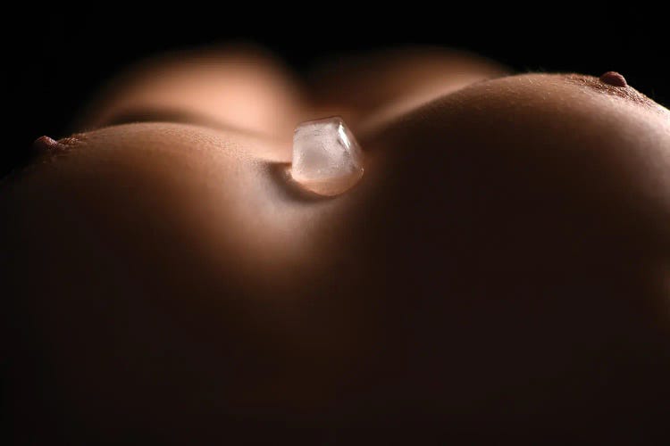 Ice Cube On Nude Woman's Breast