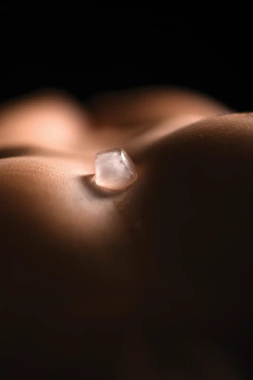 Ice Cube On Blurry Woma's Breast