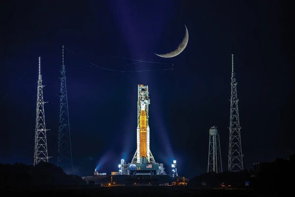 Indigo: Nasa Artemis SLS Rocket On Launch Pad And Night Moon by Alex G Perez