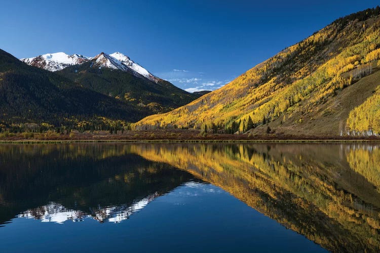 Red Mountain and autumn aspen trees reflected on Crystal Lake, Ouray, Colorado