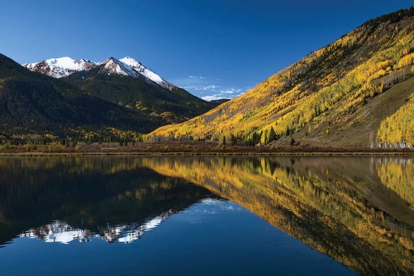 Colorado: Red Mountain and autumn aspen trees reflected on Crystal Lake, Ouray, Colorado by Adam Jones