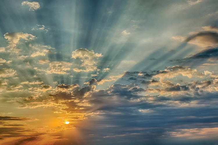 Sunbeams streaming through clouds at sunset, Cincinnati, Ohio