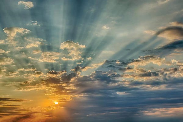 Cloudy Sunsets: Sunbeams streaming through clouds at sunset, Cincinnati, Ohio by Adam Jones