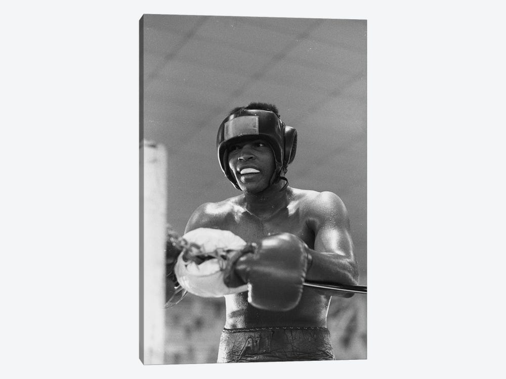 Head Gear Wearing Muhammad Ali In The Corner Between Rounds by Muhammad Ali Enterprises 1-piece Canvas Wall Art