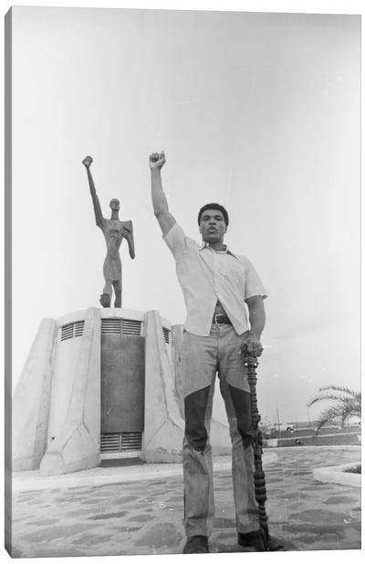 Muhammad Ali Posing In Front Of The Le Militant Statue, Kinshasa, Zaire Canvas Art Print - Sports Art