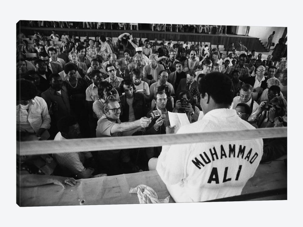 Muhammad Ali Sitting On The Side Of A Ring Talking To The Press by Muhammad Ali Enterprises 1-piece Canvas Print