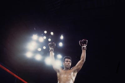 Muhammad Ali Enterprises - Unframed Prints: Post-Fight Raising Of The Arms by Muhammad Ali Enterprises