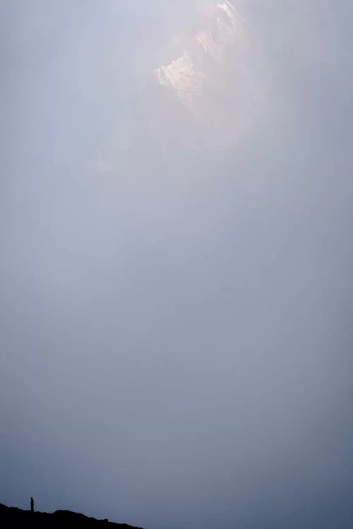 A Lone Figure Below The Imposing North Face Of Ama Dablam In The Mist, Pokalde BC, Khumbu, Nepal by Alex Buisse wall art