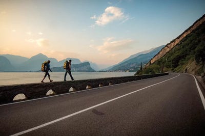 Two Climbers Walk Home Next To A Road And Lago di Gardo, Arco, Trentino, Italy by Alex Buisse acrylic art print