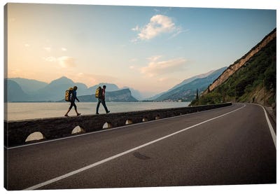 Two Climbers Walk Home Next To A Road And Lago di Gardo, Arco, Trentino, Italy Canvas Art Print