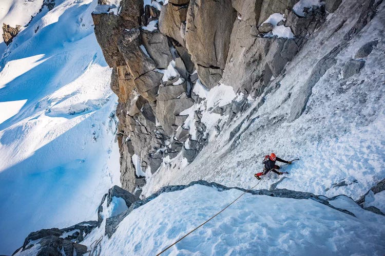 A Climber Ascending The North Face Of Tour Ronde, Chamonix, France