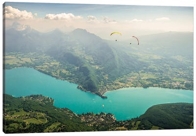 Two Paragliding Pilots Above The Annecy Lake, Haute Savoie, France Canvas Art Print - Alex Buisse