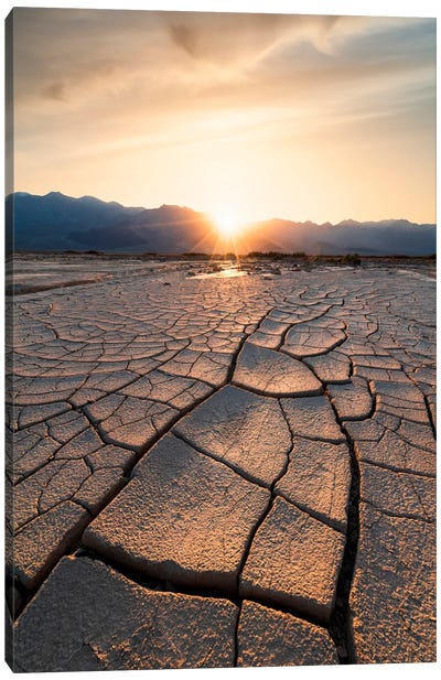 Sun Setting Beyond The Intricate Mud Cracks Of Death Valley Canvas Art Print - Alexander Sloutsky