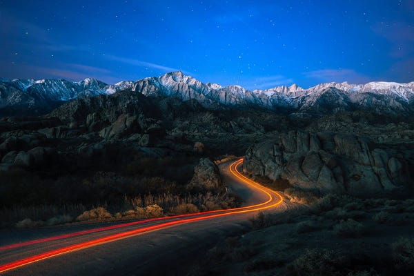 Sierra Nevada: Starry Pathways - Car Trails From Alabama Hills To Snow-Capped Sierra Nevada by Alexander Sloutsky