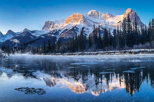 Snowy Mountains: Golden Light Over Icy Waters by Brian Bielke