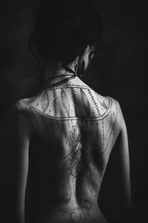 Portrait Of Woman With Back Tattoo