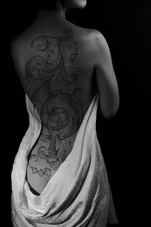 Portrait Of Sexy Woman With Back Tattoo