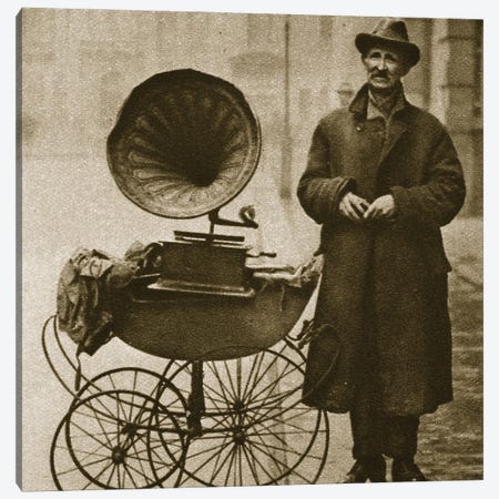 A Street Hawker Entertains With A Gramophone Transported In A Pram Canvas Print #BMN11266} by English Photographer Art Print