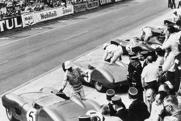 Vintage & Retro Photography: Roy Salvadori & Stirling Moss Entering Their Aston Martin DBR1's Before The Start, 24 Hours of Le Mans, France, 1959 by Rue Des Archives