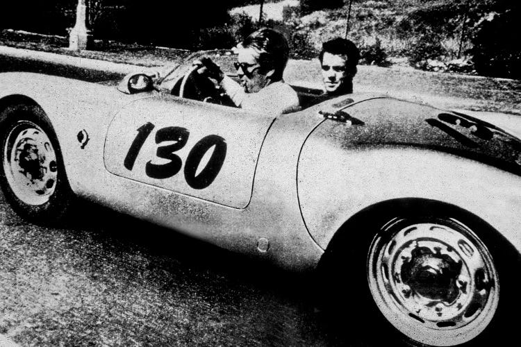 The American Actor James Dean driving his Porsche Spider 550A with Rolf Wutherlich , in 1955