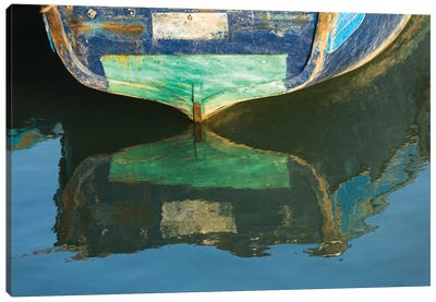 Morocco, Essaouira. An artistic watercolor effect of a wooden boat floating in the harbor. Canvas Art Print