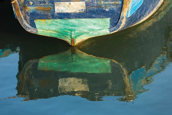 Brenda Tharp: Morocco, Essaouira. An artistic watercolor effect of a wooden boat floating in the harbor. by Brenda Tharp