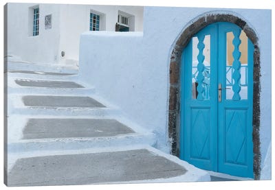 Greece, Santorini. Blue door livens up a quiet alley of white-washed homes in Pyrgos. Canvas Art Print