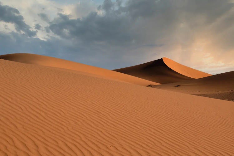 Sand Dunes Glow Orange At Sunset In The Sahara Desert