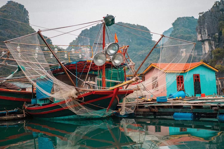 Asia, Vietnam, Quang Ninh, Ha Long Bay. Colorful Fishing Boat At Its Dock Is Reflected In Calm Bay Waters.