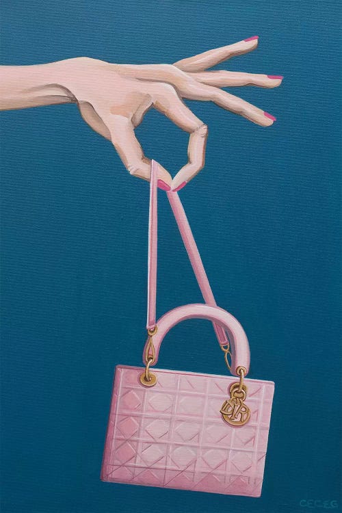 Hand Holding A Dior Bag