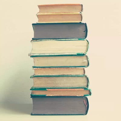 Stack Of Books by Caroline Mint framed canvas print