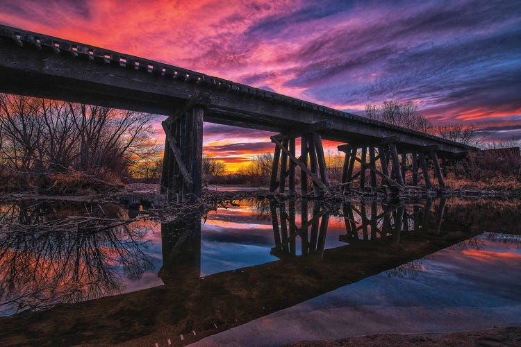 Reflected Railroad Trestle At Sunset