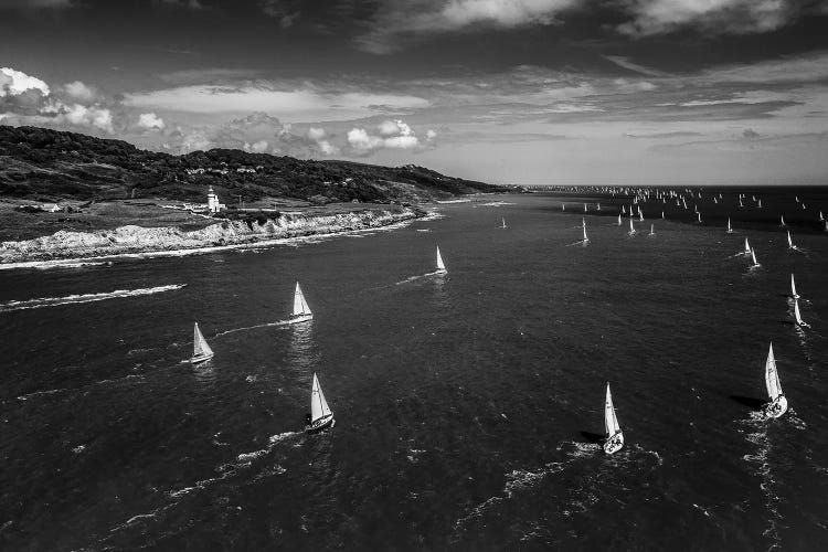 A Fleet Of Yachts Sailing Past St Catherine's Lighthouse