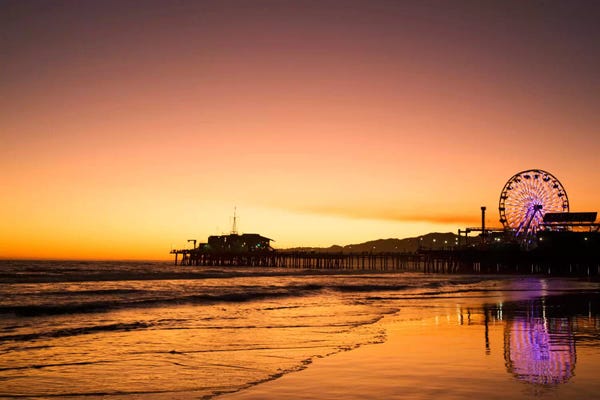 Ferris Wheels: Santa Monica Pier At Sunrise, Santa Monica, California, USA by Dennis Flaherty