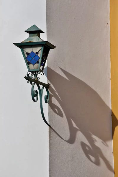 Hardware: San Miguel De Allende, Mexico. Lantern and shadow on colorful buildings by Darrell Gulin