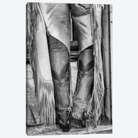 Horse drive in winter on Hideout Ranch, Shell, Wyoming. Cowgirl detail of boots and chaps in doorway of log cabin. Canvas Print #DGU170} by Darrell Gulin Canvas Artwork