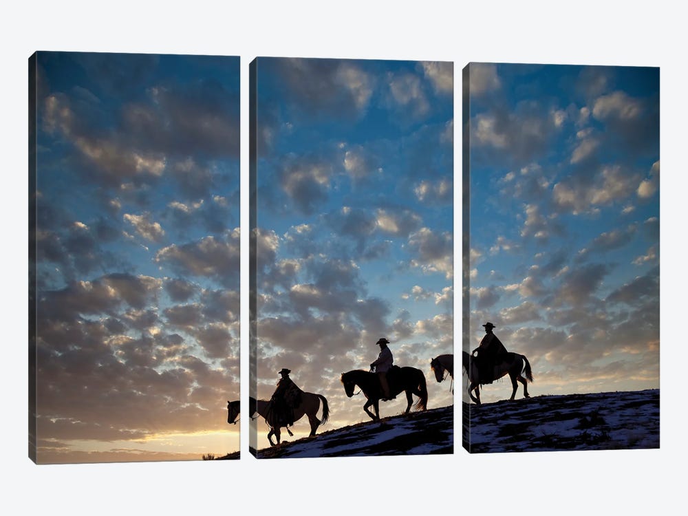 USA, Shell, Wyoming Hideout Ranch Cowboys And Cowgirls Silhouetted Against Sunset Riding On Ridgeline I by Darrell Gulin 3-piece Canvas Art