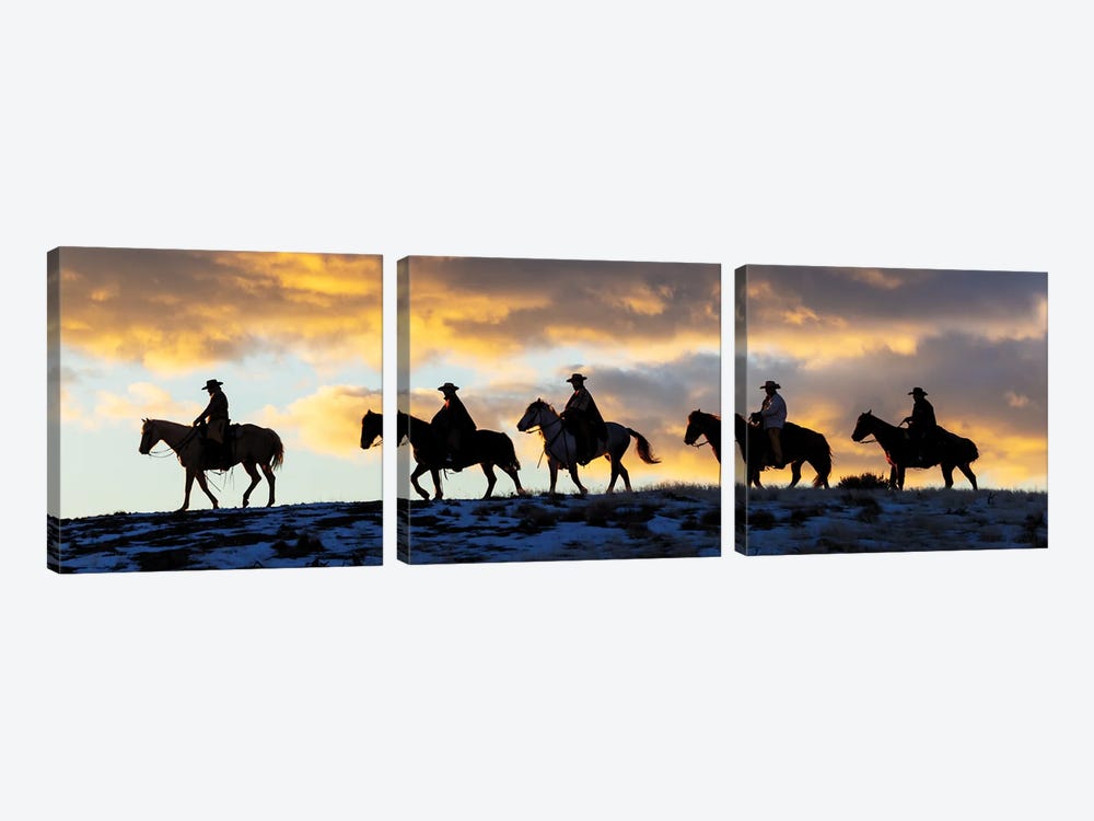 USA, Shell, Wyoming Hideout Ranch Cowboys And Cowgirls Silhouetted Against Sunset Riding On Ridgeline II by Darrell Gulin 3-piece Canvas Print