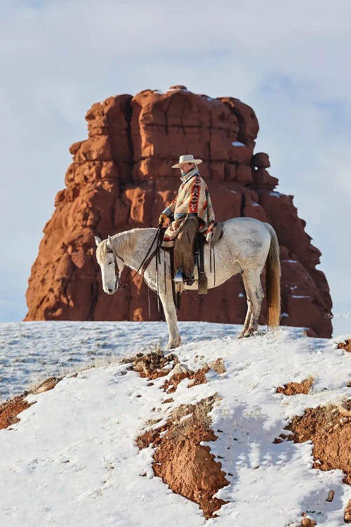 USA, Wyoming Hideout Ranch Cowgirl On Horseback Riding On Ridgeline Snow