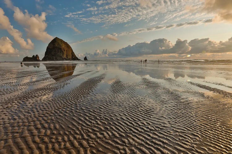 USA, Oregon, Cannon Beach. Sunset Golden Colors With Ripples In Sandy Beach And The Haystack Rock