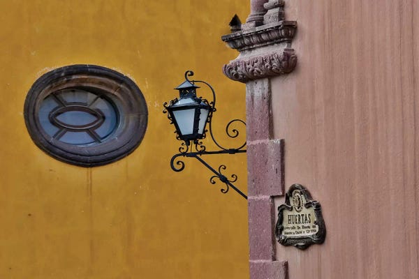 Hardware: San Miguel De Allende, Mexico. Lantern and shadow on colorful buildings by Darrell Gulin