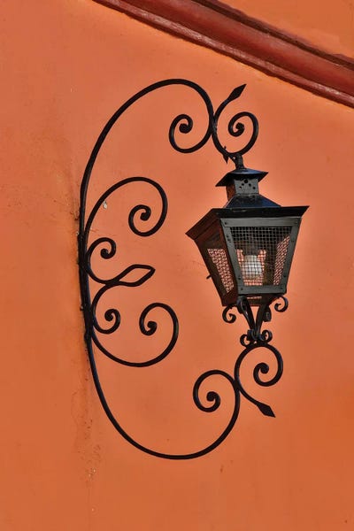 Hardware: San Miguel De Allende, Mexico. Lantern and shadow on colorful buildings by Darrell Gulin