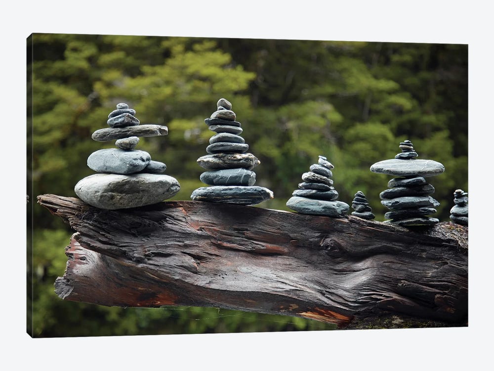 Rock stacks made by tourists by Fantail Falls, Haast Pass, Mt. Aspiring NP, New Zealand by David Wall 1-piece Canvas Artwork